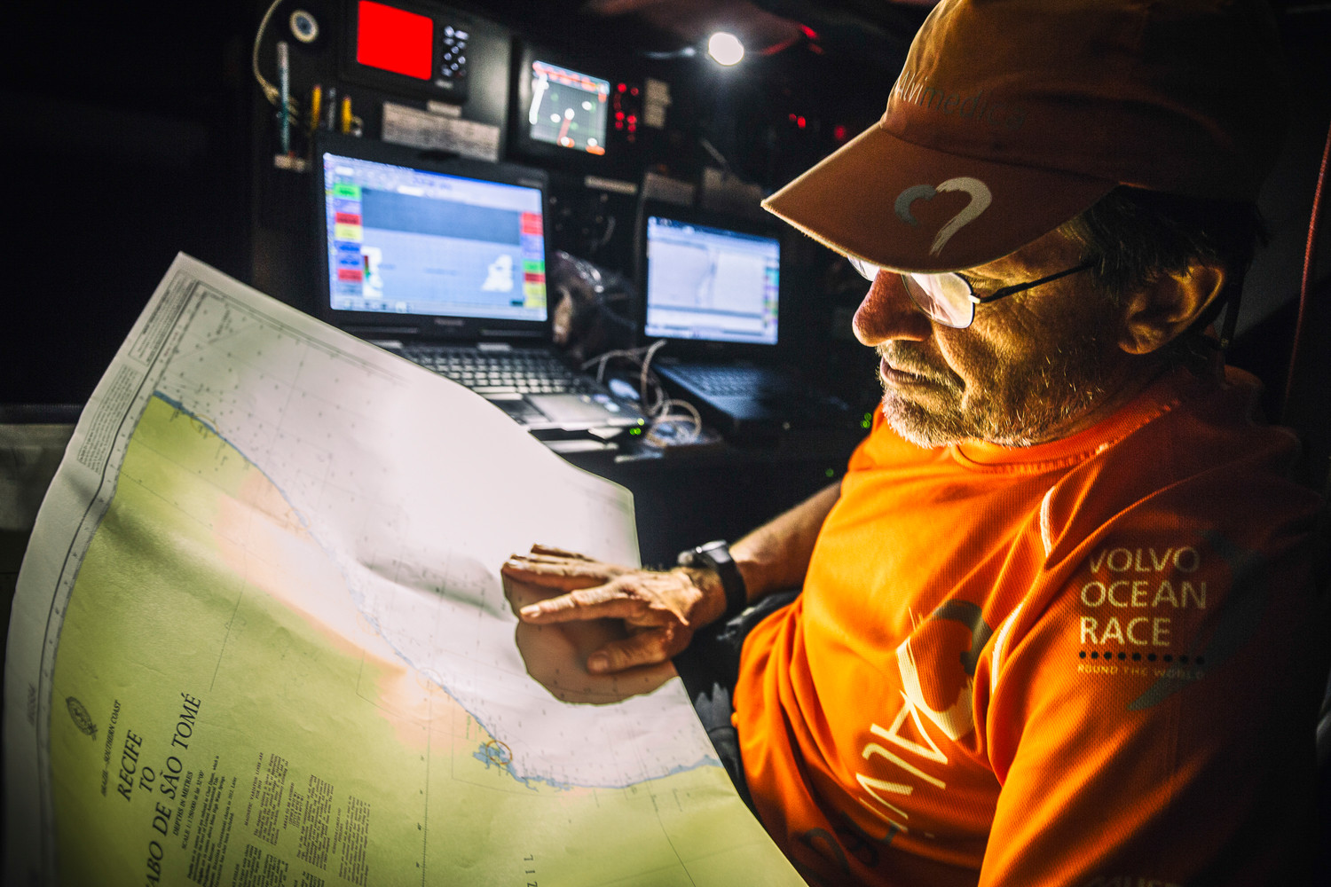 October 25, 2014. Leg 1 onboard Team Alvimedica. Day 14. After rounding Fernando de Noronha off Brazil, the last turning mark on the course until the finish, focus turns to the fast and furious conditions ahead to Cape Town. Navigator Will Oxley still carries traditional paper charts for every potential destination along the course around the world; technology is great when it works but sometimes traditional means are most trustworthy.